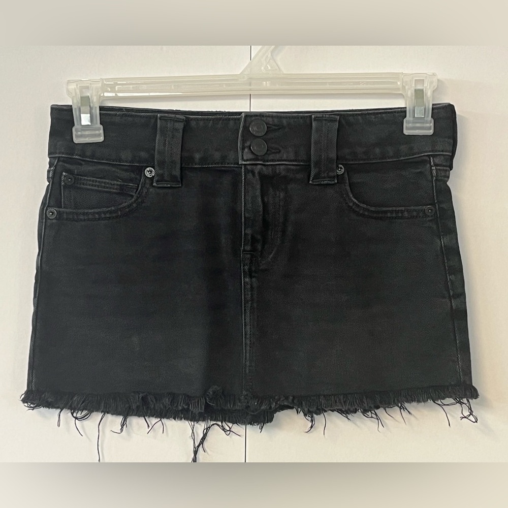 American Eagle black factory distressed jean skirt. Size 00